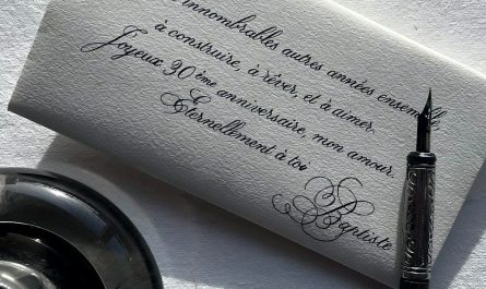 Calligraphy on envelope with ink pen and inkwell.