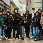 a group of young people standing next to each other