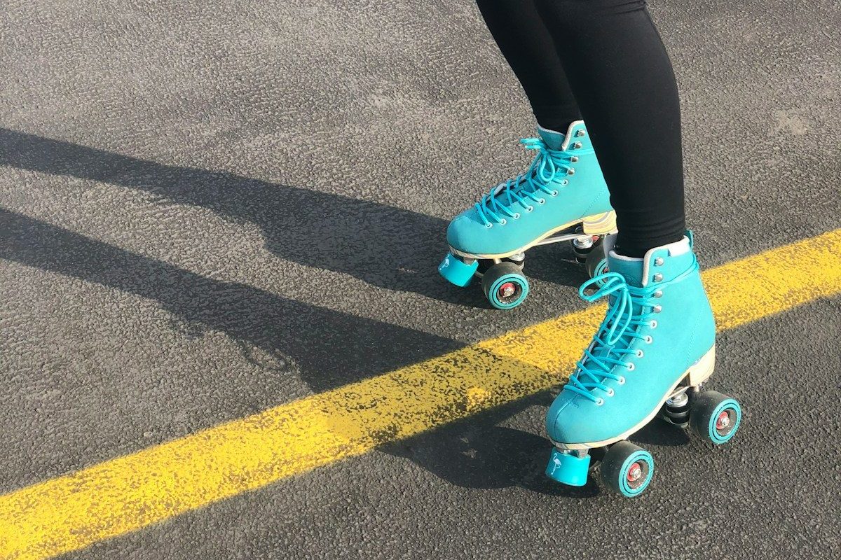 woman in blue nike sneakers and black leggings